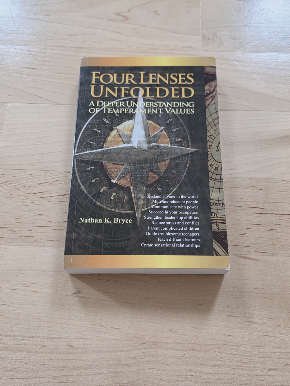 Four Lenses Unfolded by Nathan K. Bryce - Black and Gold Cover